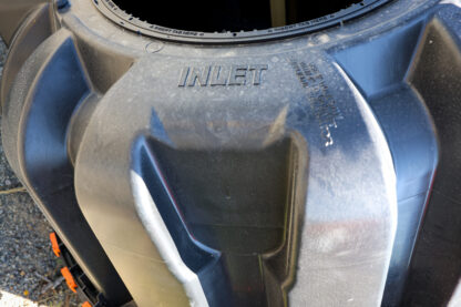 black plastic septic tank inlet