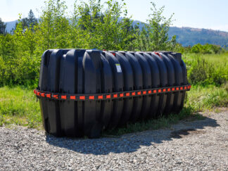 a large black plastic tank with two holes